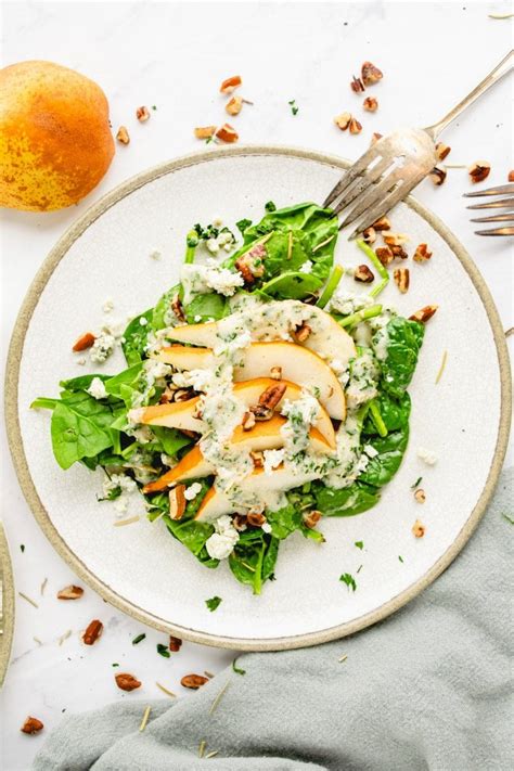 spinach-and-pear-salad-with-rosemary-vinaigrette image