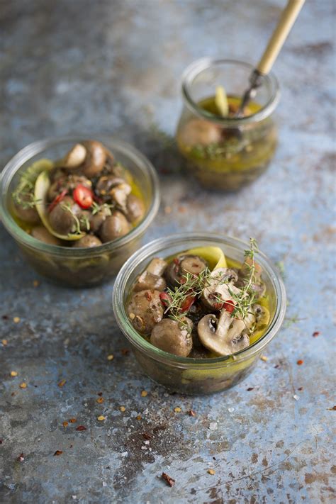 pickled-mushrooms-with-herbs-lemon image