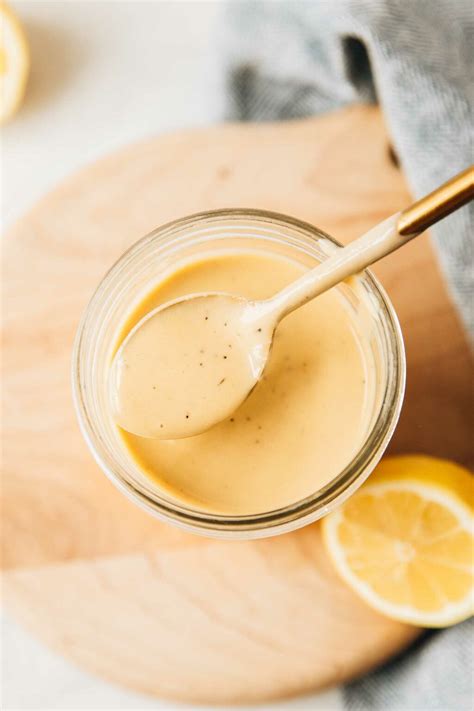 the-best-creamy-lemon-tahini-dressing-jar-of-lemons image