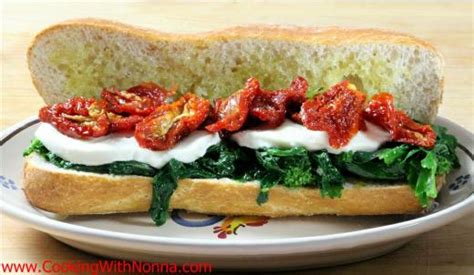 broccoli-rabe-mozza-and-sun-dried-tomatoes-sandwich image