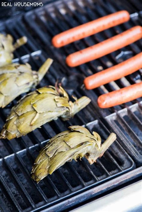grilled-artichokes-with-honey-sriracha-dipping-sauce image