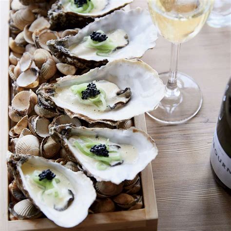 poached-oysters-with-pickled-cucumber-and-caviar image