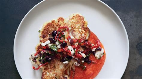 cauliflower-steaks-with-olive-relish-and-tomato-sauce image