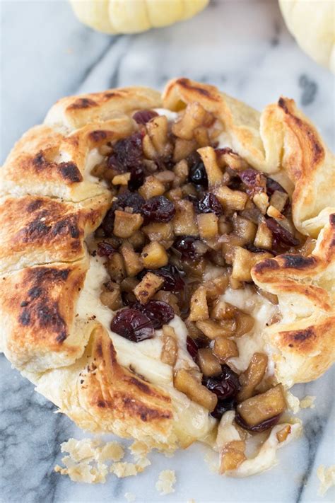 apple-cranberry-baked-brie-cake-n-knife image