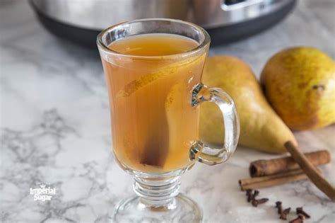 slow-cooker-spiced-pear-cider-the-daily-meal image