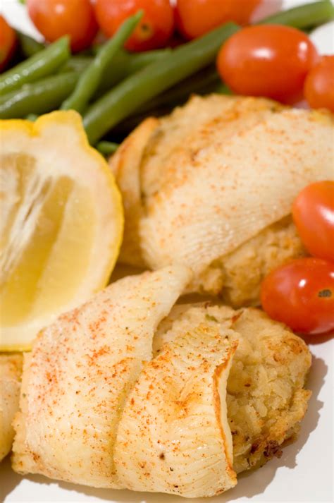 crab-stuffed-flounder-or-sole-baked-in-a-tomato image