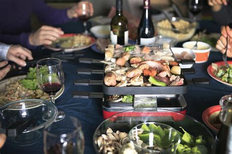 how-to-throw-a-raclette-dinner-party-the-spruce image