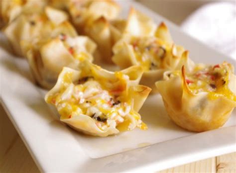 crab-and-cheddar-baked-wonton-purses-appetizer image
