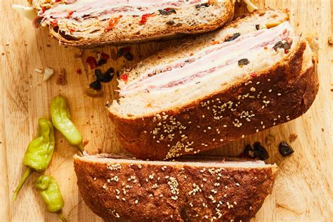 best-muffuletta-sandwich-recipe-feeds-a-crowd-kitchn image