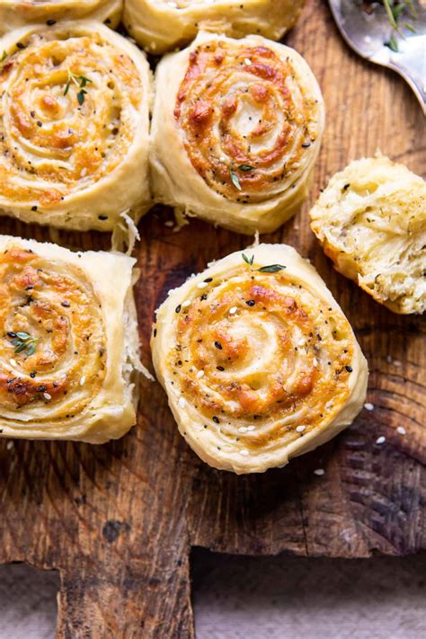 herby-everything-cheddar-swirl-buns-half-baked-harvest image