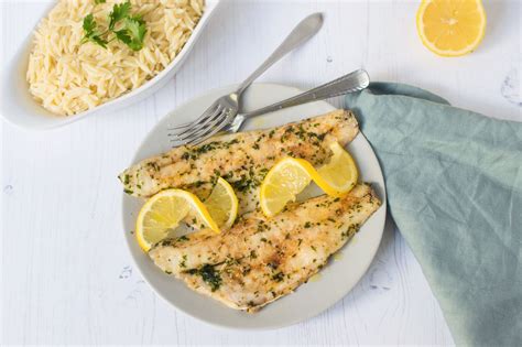 grilled-sea-bass-with-garlic-butter-recipe-the-spruce image