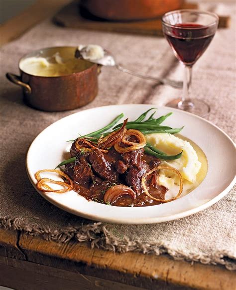 braised-venison-with-prunes-port-and-crispy-onions image