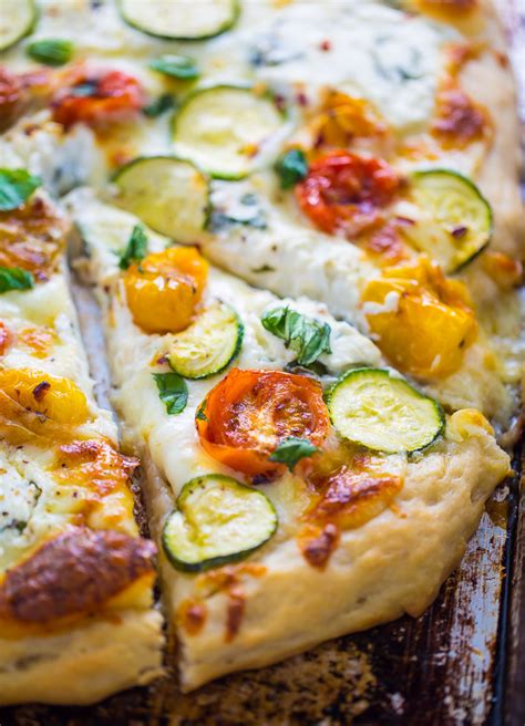 white-pizza-with-tomatoes-basil-and-zucchini-baker image