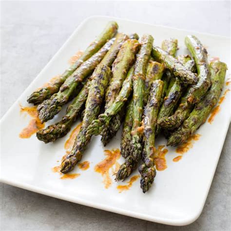 grilled-asparagus-with-cumin-butter-cooks-illustrated image