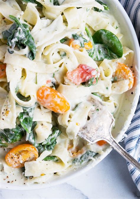 creamy-goat-cheese-pasta-with-spinach-and-tomatoes image
