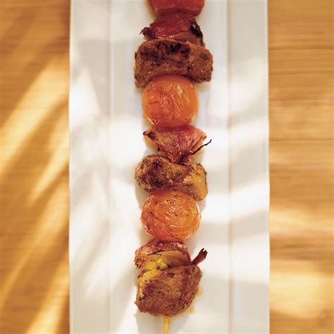 curried-lamb-kabobs-with-cherry-tomatoes-and-red image