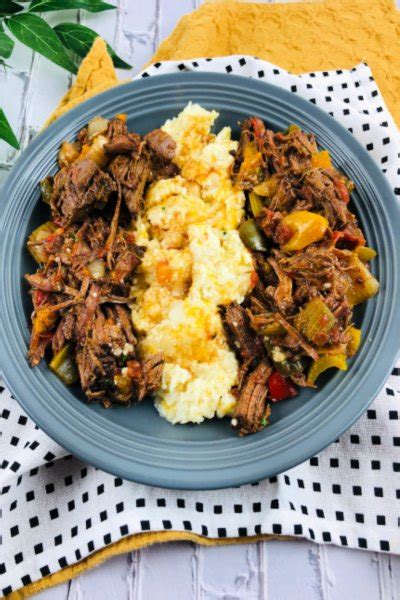 slow-cooker-cajun-shredded-beef-with-cheesy-grits image