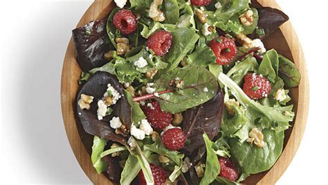 mixed-green-salad-with-ricotta-salata-walnuts-and-raspberry image