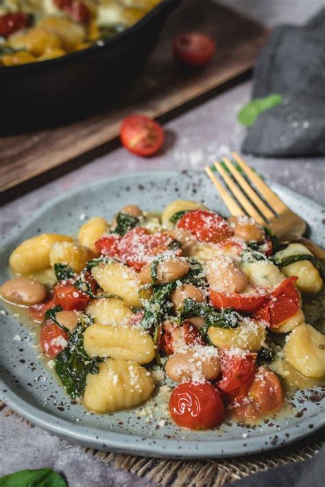 baked-gnocchi-with-spinach-tomatoes-and-beans image
