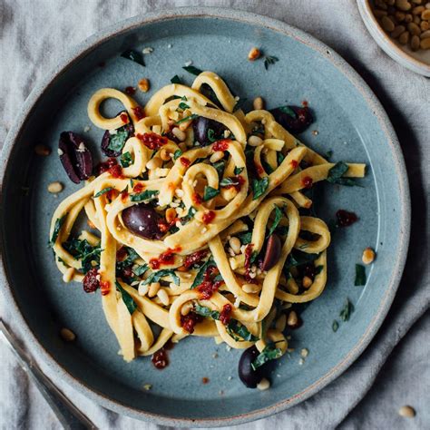 chickpea-fettuccine-with-harissa-kale-and-olives image