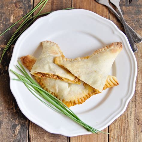 spanish-empanadas-with-roasted-peppers-goat-cheese image