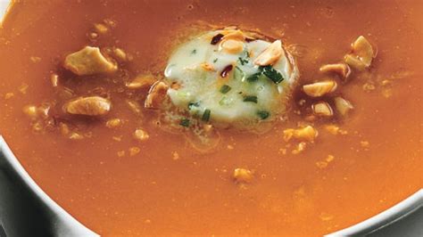 carrot-ginger-soup-with-chile-butter-and-roasted-peanuts image