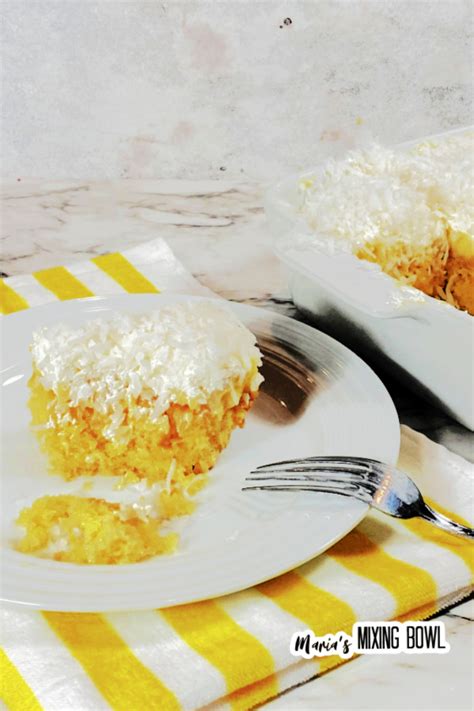 pineapple-coconut-poke-cake-marias-mixing-bowl image