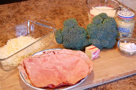 baked-ham-and-broccoli-rolls-with-swiss-cheese-sauce image