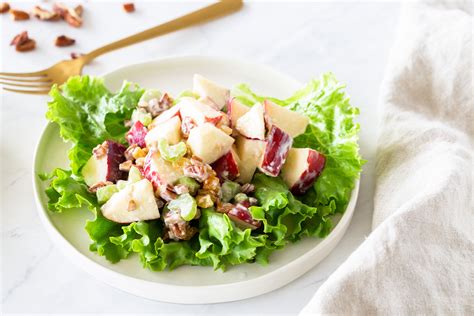 apple-salad-with-pecans-and-raisins-recipe-the-spruce image