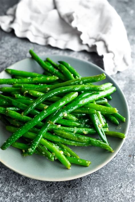 sauted-green-beans-with-garlic-butter-sweet-peas image