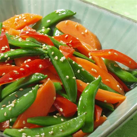 sesame-snap-peas-with-carrots-peppers-eatingwell image