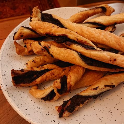 puff-pastry-twists-with-greek-tapenade-poupadou image