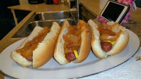 new-york-style-onion-sauce-over-sabrett-hot-dogs image