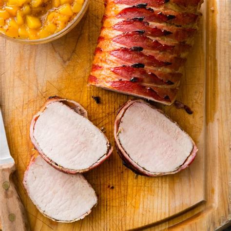 bacon-wrapped-pork-roast-with-peach-sauce-cooks image