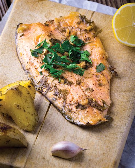 broiled-steelhead-trout-with-lemon-garlic-and-rosemary image