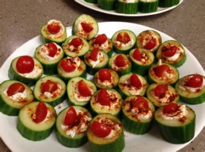 cucumber-bites-with-herb-cream-cheese-and-cherry image