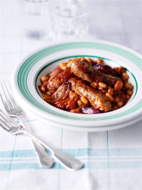 roasted-sausages-and-beans-recipe-delicious-magazine image