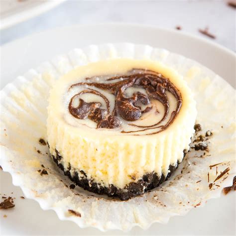 easy-mini-chocolate-swirl-cheesecakes-the-busy-baker image