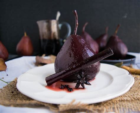 pear-poached-in-spiced-red-wine-recipe-archanas image