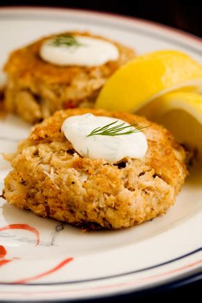 crab-cakes-with-lemon-dill-sauce-recipe-paula-deen image
