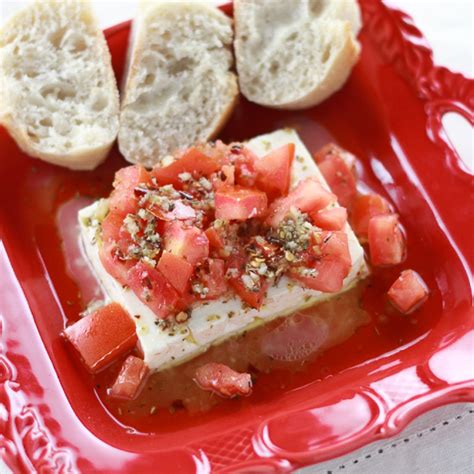 baked-feta-with-tomatoes-feta-psiti-lemon-olives image