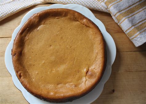 pumpkin-cheesecake-with-gingerbread-cookie-crust image