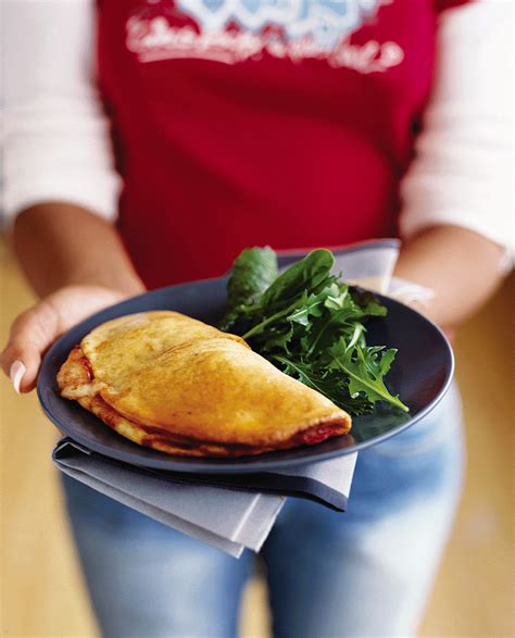 tomato-and-mozzarella-calzone-recipe-delicious-magazine image