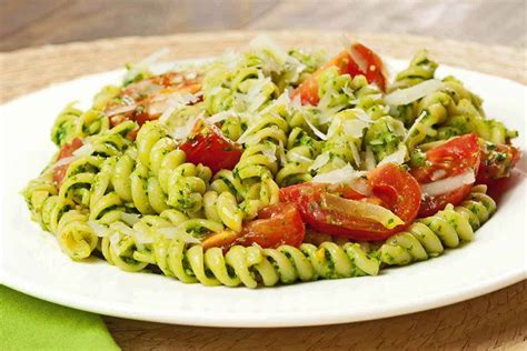 rotini-with-spinach-basil-pesto-and-tomatoes image