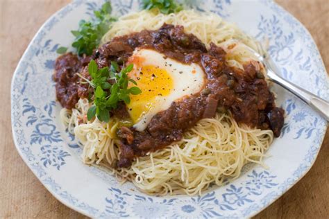recipe-eggs-in-puttanesca-with-angel-hair-pasta image