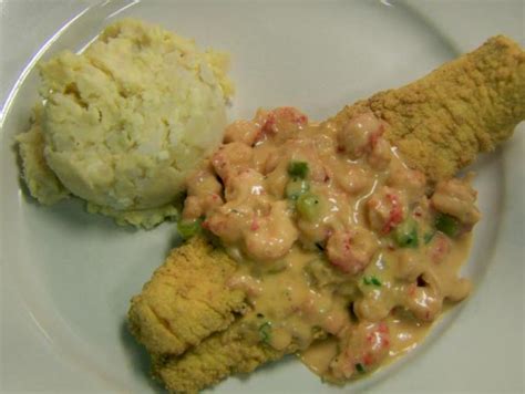fried-catfish-topped-with-crawfish-au-gratin-sauce image