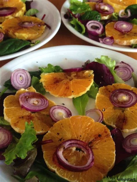 vibrant-orange-salad-recipe-with-red-onions-and-greens image
