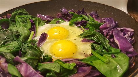 warm-spinach-salad-with-sunny-side-up-eggs image