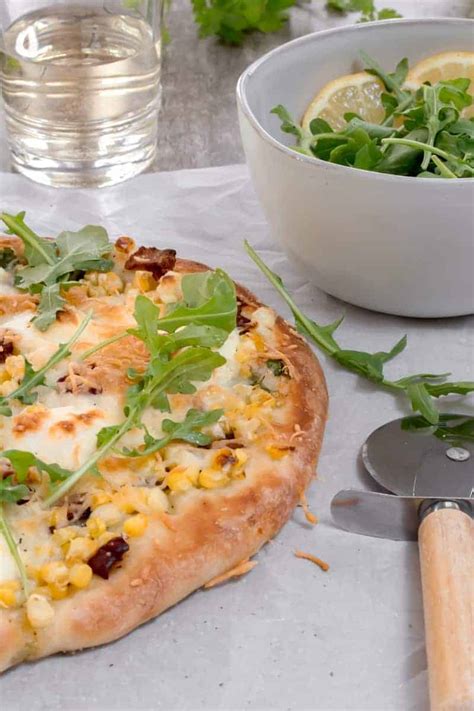 sweet-corn-and-bacon-pizza-with-arugula-maple-and image