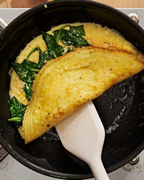 spinach-omelet-recipe-fluffy-with-parmesan-the-kitchn image